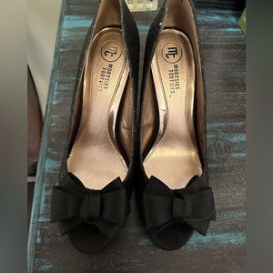 NIB. Black glitter peep toe pumps with Satin bow. Great for formals or prom